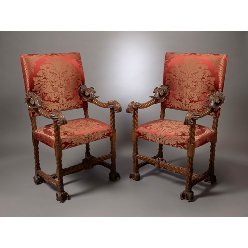 A Pair of Baroque Carved Armchairs